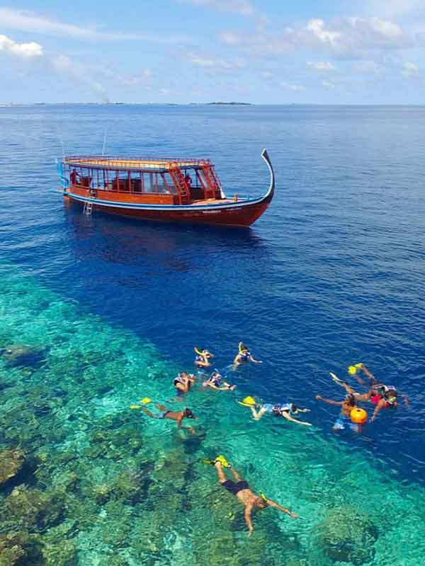 Maldives snorkeling with dhoni